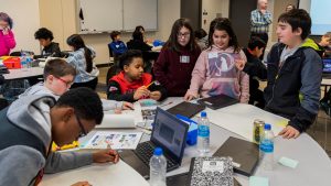 students collaborating at table